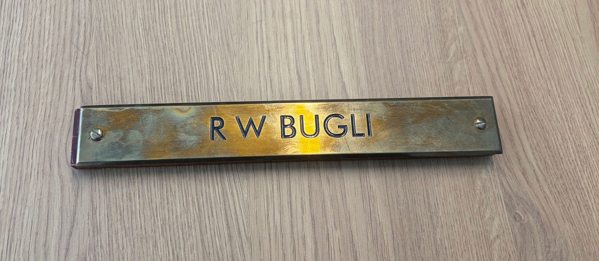 A nameplate that says R W Bugli