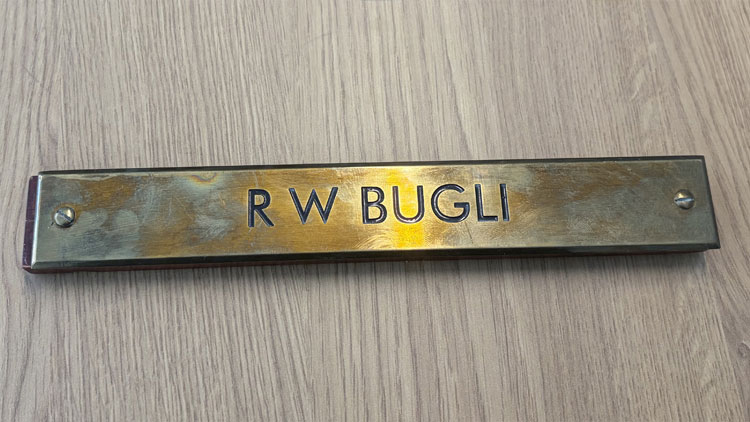 Name plate with th words  R W Bufl 