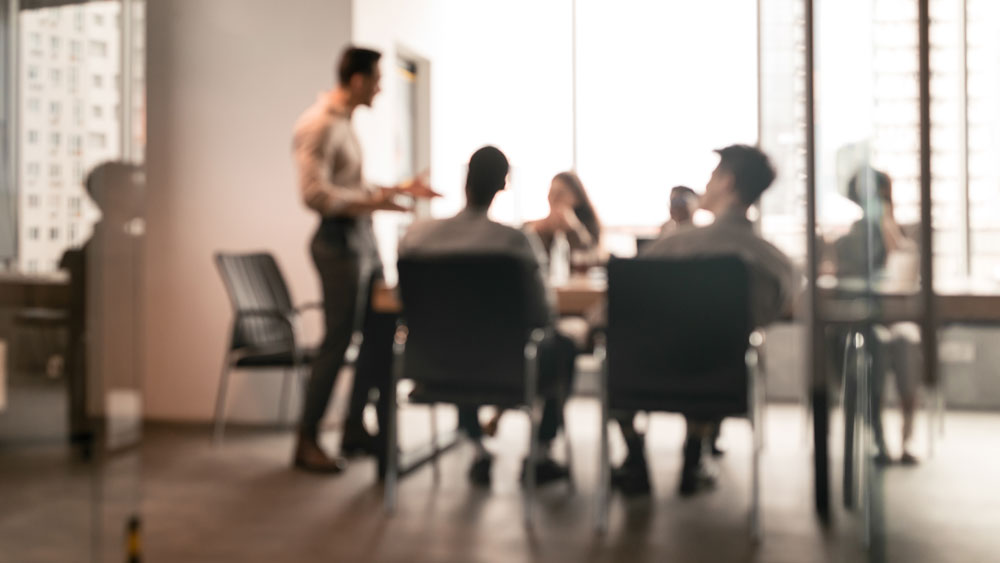A business meeting in a blurred image